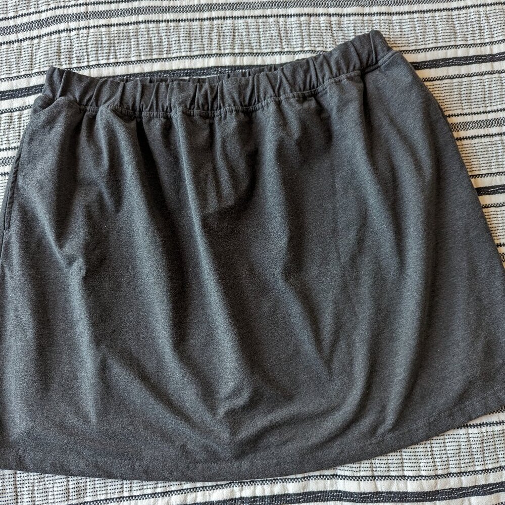 Woman Within Dark Gray Skort